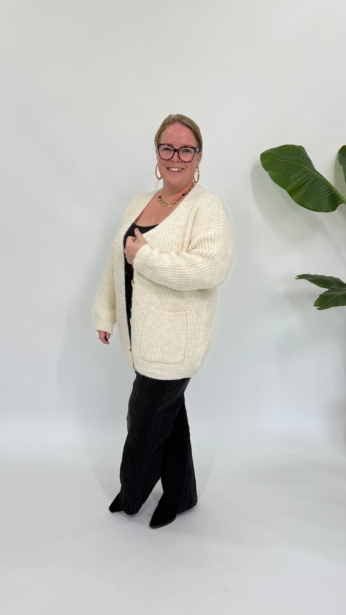 VEST MET ZAKKEN CREME