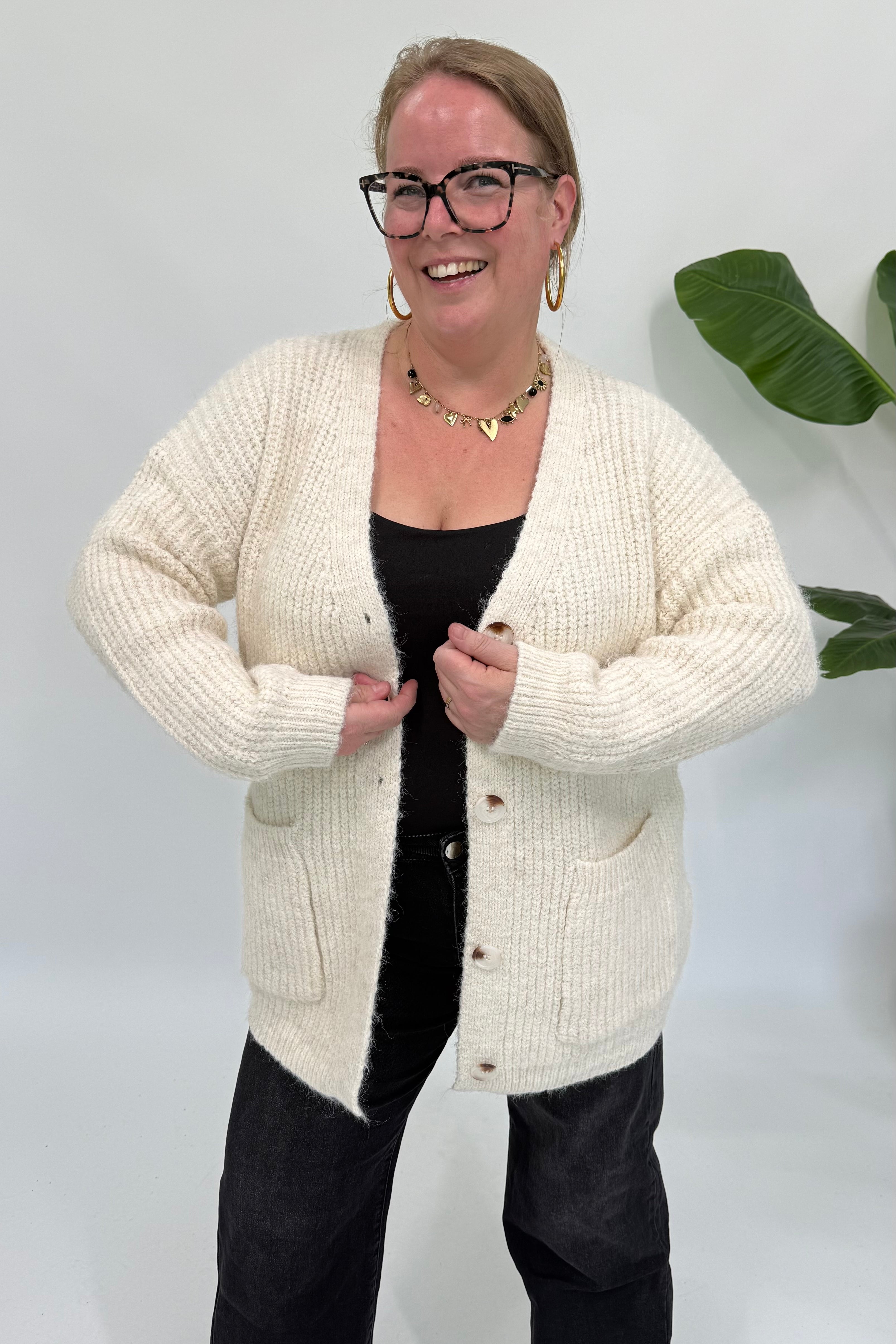 VEST MET ZAKKEN CREME